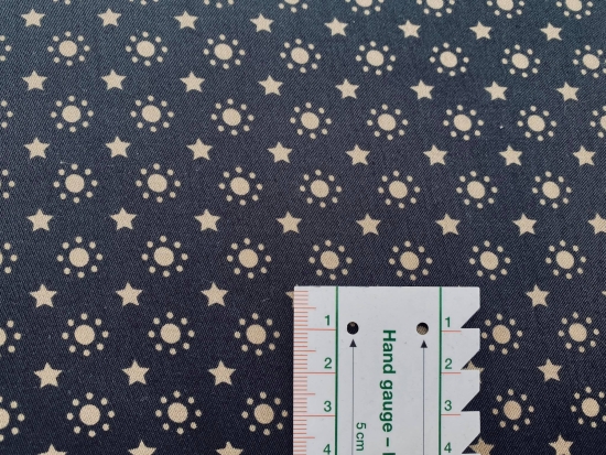 Baumwolle Webware goldene Punkte und Sterne auf schwarz